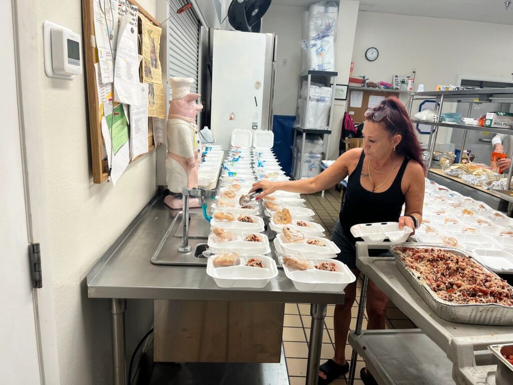 Feed Thy Neighbor volunteer preparing hot meals for the homeless.